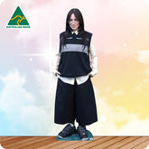 Cardboard cutout of a person wearing a black and white outfit with 'Australian Made' logo in the corner.